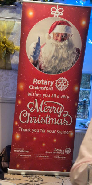 A Chelmsford Rotary pull-up banner withing everyone a Merry Christtmas