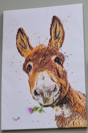 Painting of a donkey wearing a hat and chewing flowers