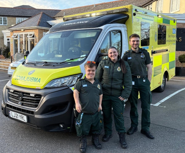 The ambulance crew An ambulance with three crew members standing in front of it