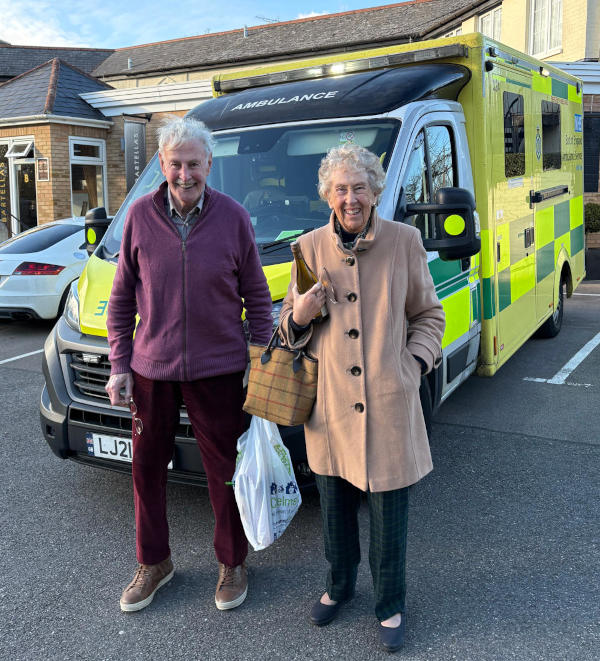 Geoff and Angela Dickman in front of an ambulance Ambulance with a man and woman standing in front of it