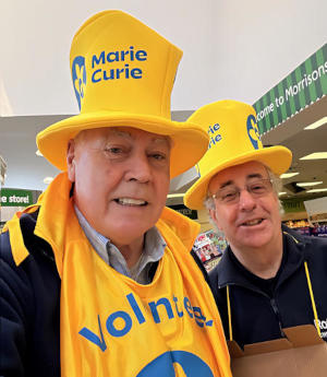 Two men wearing Marie Curie top hats
