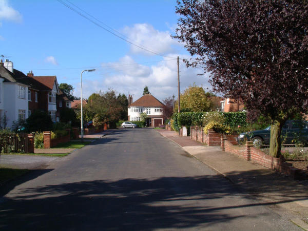 Entering Green Close Looking along a residential road with a cream house at the end