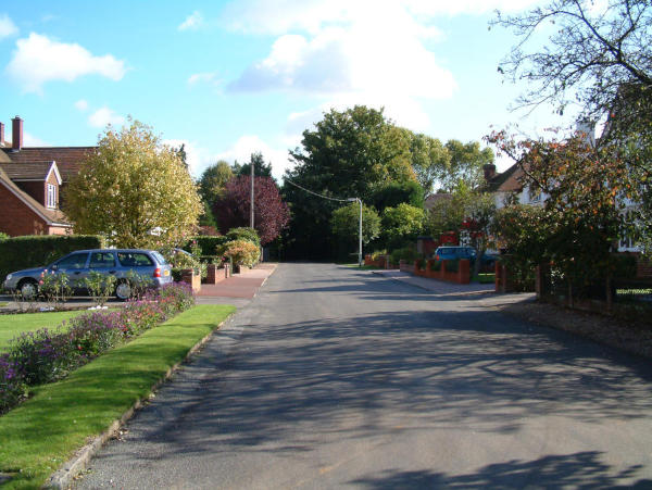 Leaving Green Close Looking along a residential road towards a junction