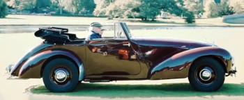 A shiny red 1950s sports car