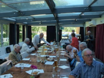 People seated round a long table
