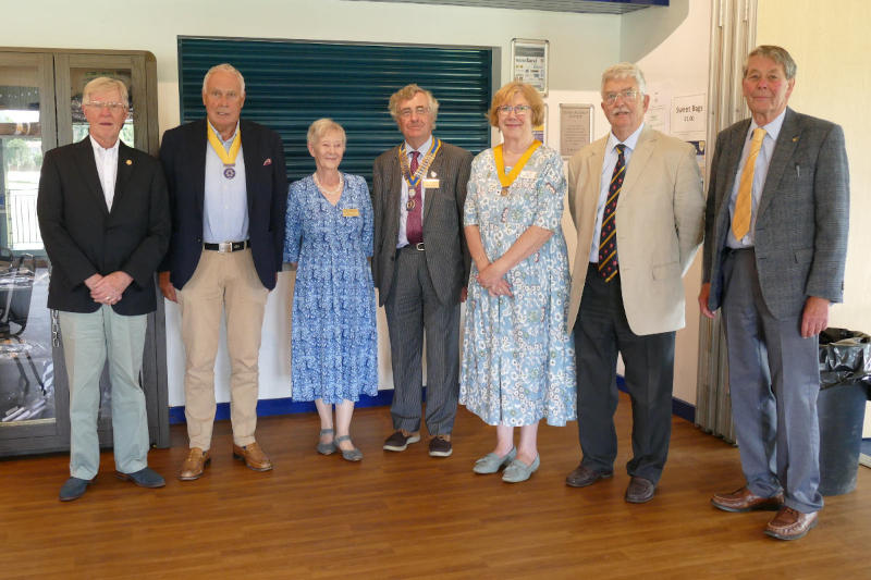 Seven people standing in a line
