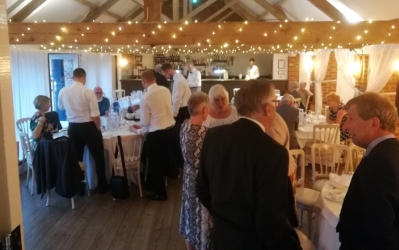 People chatting in a decoarted dining hall