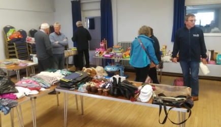 People looking at tables of jumble