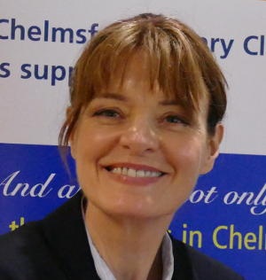 A smiling woman with short hair