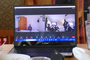A netbook computer showing a Zoom meeting in progress