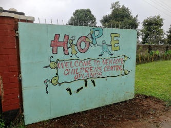 An solid metal entrance gate welcoming people to New Hope