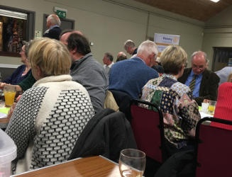 Groups of people sitting at tables