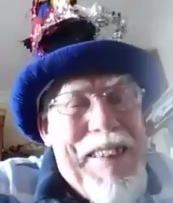 Smiling bearded man in a fancy blue hat