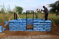 Ramming down the earth bags