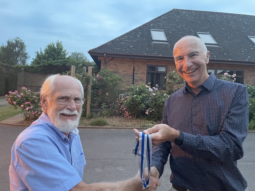 Chris Howick Secretary for the past 8 years hands to Bill Whitlow