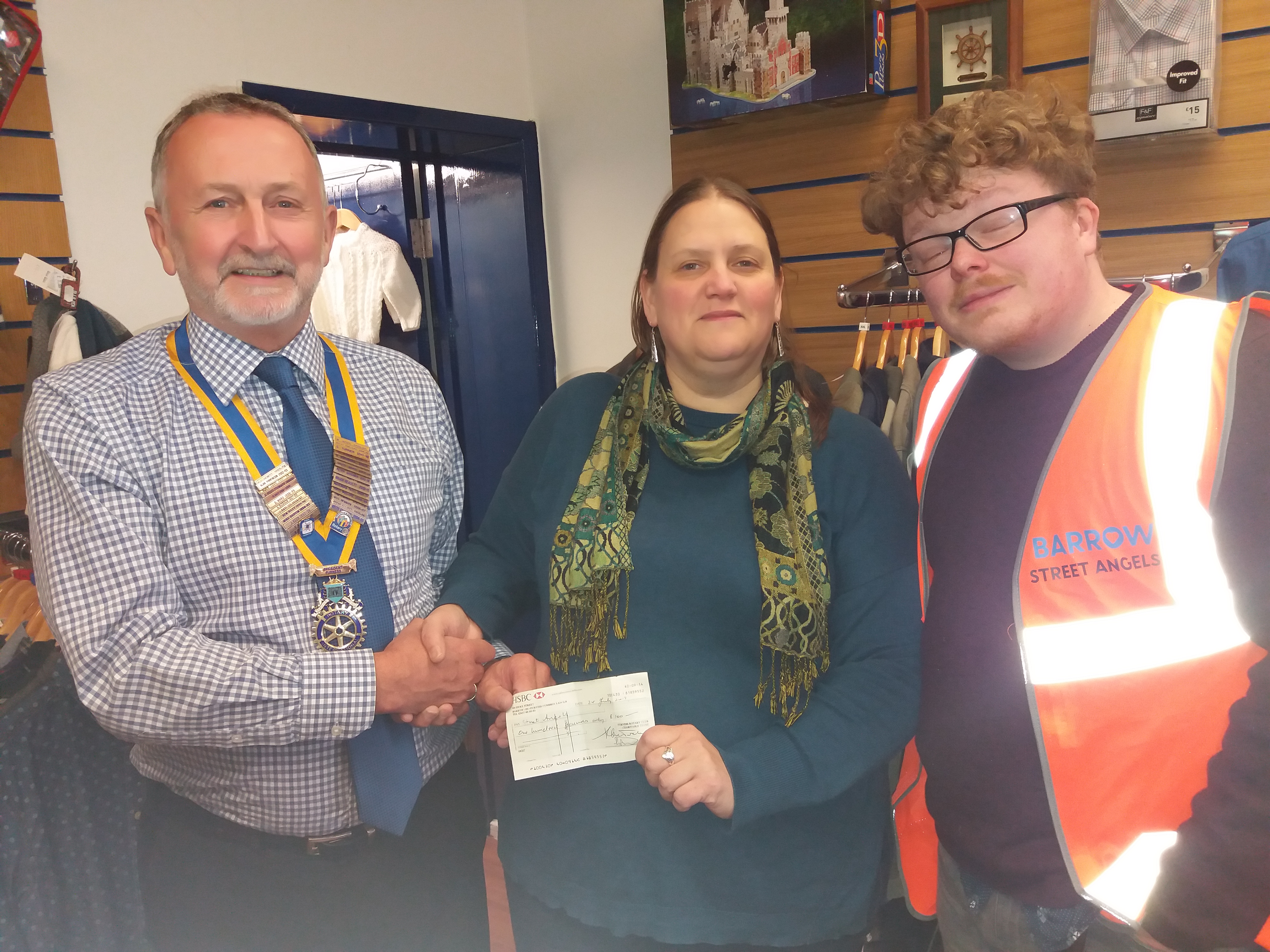Brian hands over cheque for £100 to the Rev Sophie & Tim of the Street Angels Oct 2019