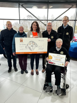 Cheque being presented to Charlie House