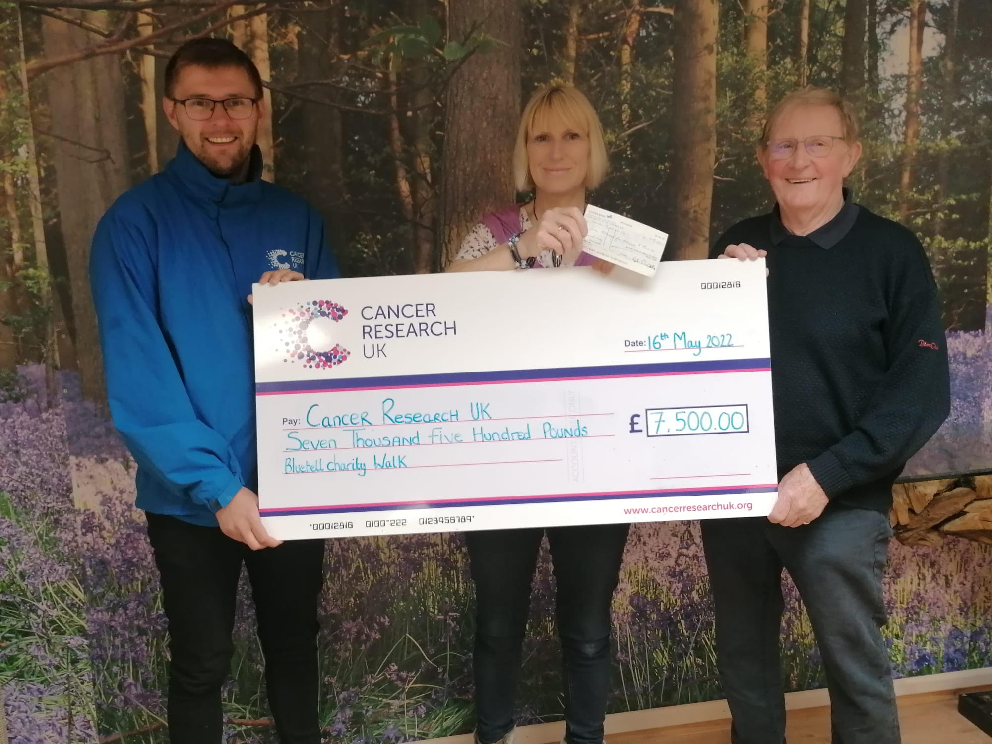 Haimes family give cheque to Cancer Research UK and Henley Rotary Club
