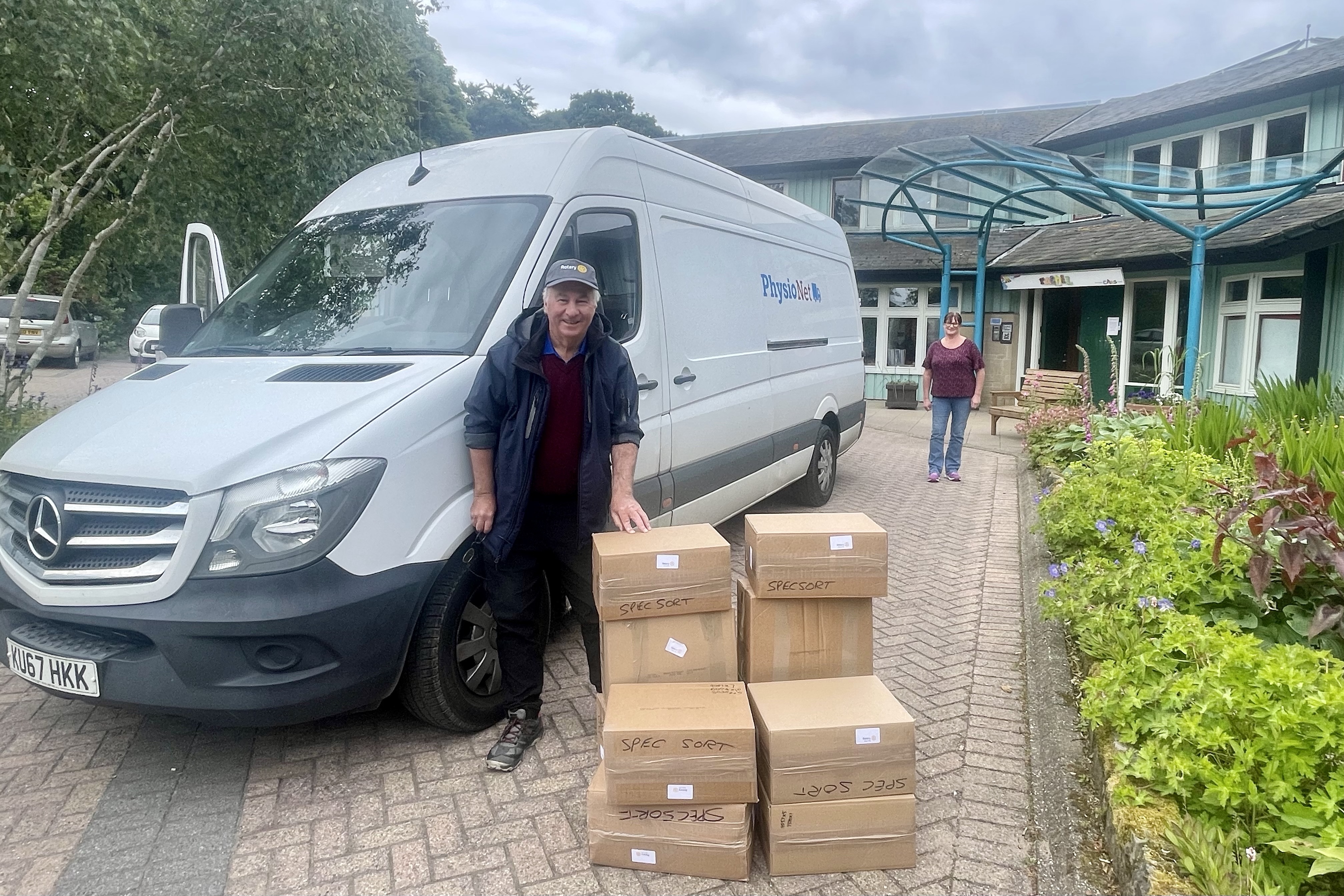 Packing boxes of used and unwanted spectacles into PhysioNet van