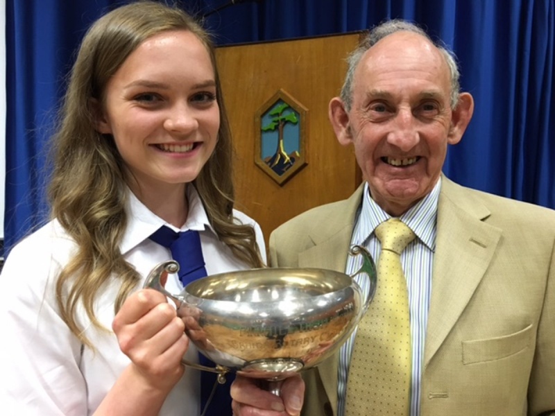 Caroline McNish receiving the Braids Rotary Cup from John Stevenson