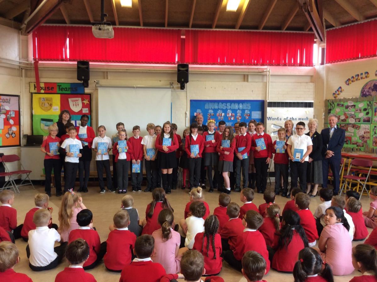 Dictionaries for Tameside Schools - Year 6 receiving their dictionaries from President Peter