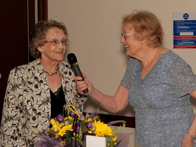President's Induction Meeting 2012 - Nina and Maureen giving a speech after being presented with some thank you flowers by Tony for organising our Ladies lunch meetings