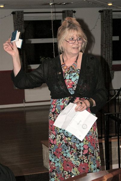 Charter Night - Jenny explains the gift notebooks for the lady guests.