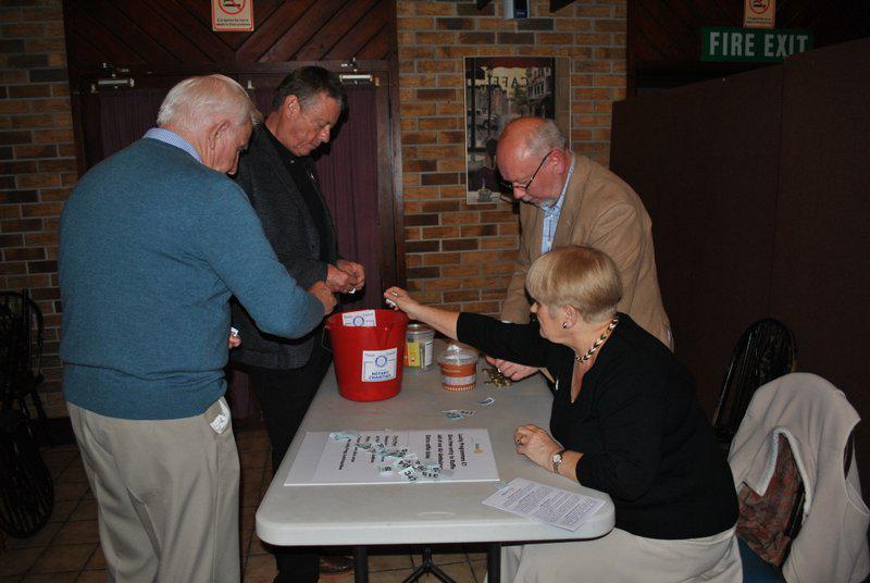 Treorchy Male Choir comes to Knighton - Adam, Ian, Norman and Margaret folding tickets for the raffle draw 