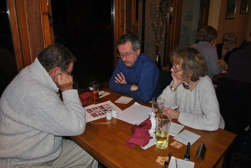 Family Quiz with supper Baron of Beef  - Ivan Colin and Andrea mulling over the picture round