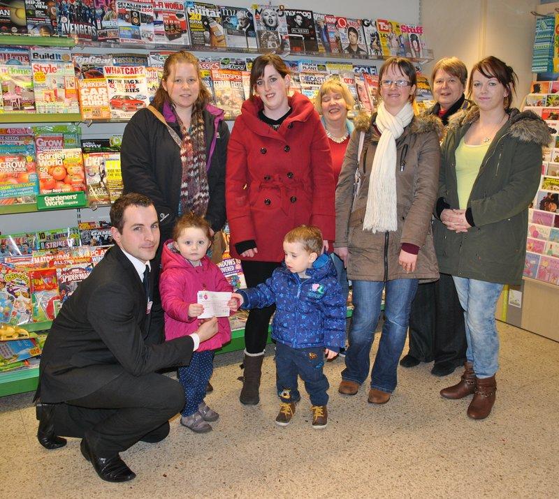Tuffins Supermarket support us through their MADL charity - David with recipients 3