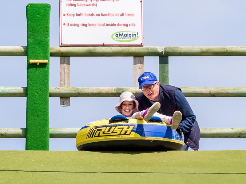 KidsOut Day 2015 - Steve sets another one off on the slippery slope.
