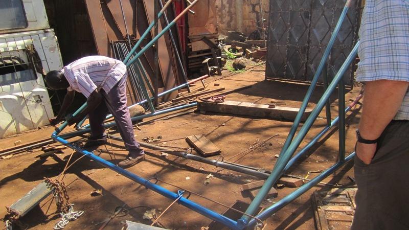 2015: Visit to Tanzania - Swings being painted at Msandaka School