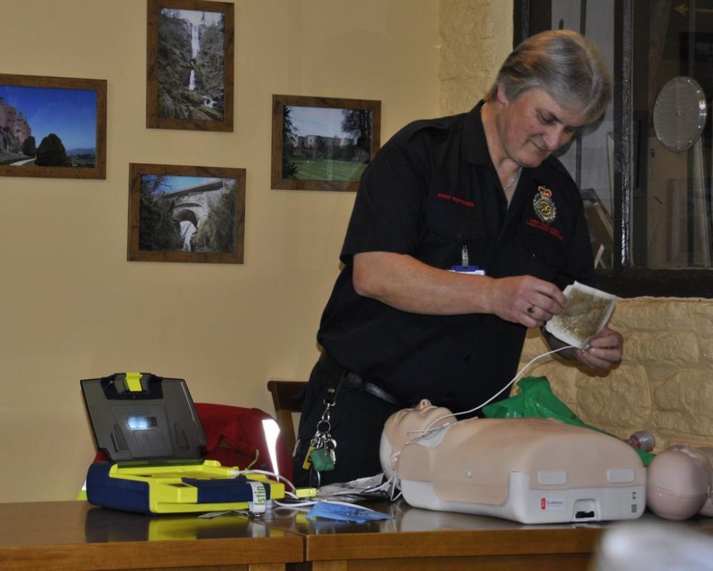 Dinner and First Responders speaker at the Baron - Applying the adhesive pads to the chest