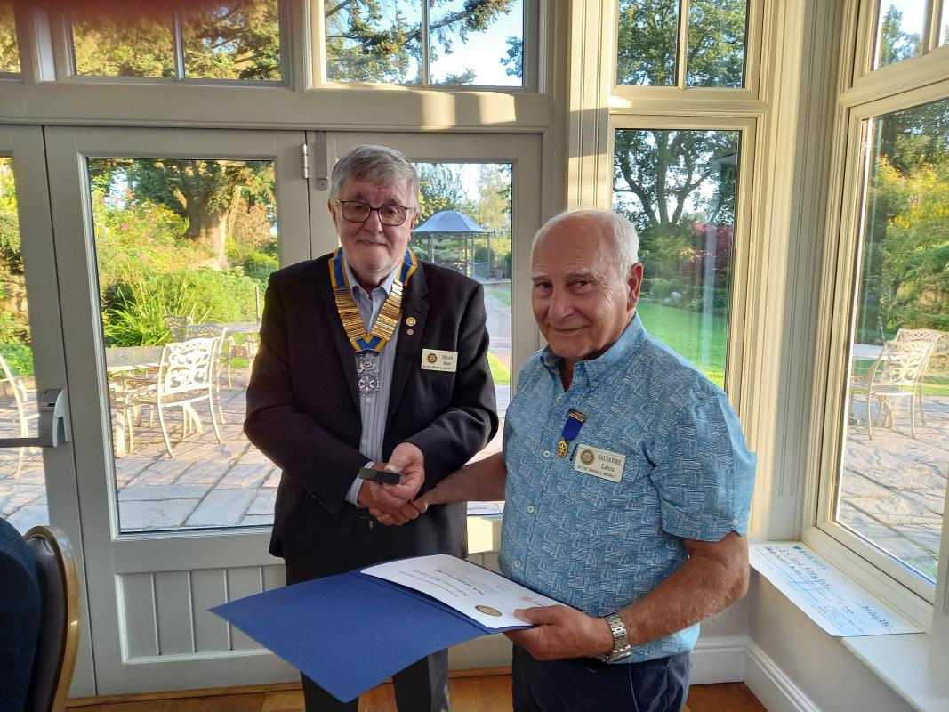 2023 - End of One & The Start of a New Rotary Year  - President Brian presenting Sam with his Paul Harris Fellow award in recognition of outstanding service over many years.