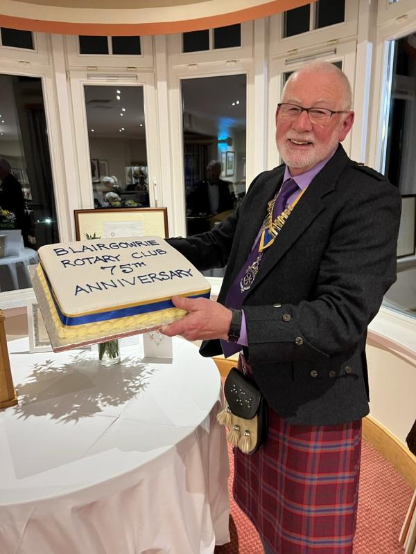 75th Charter Dinner - President Bob shows off the birthday cake