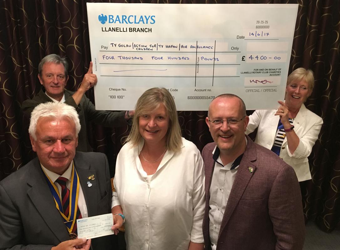 Llanelli Rotary Club presents £4400 to local charities - Santa's Grotto cheques