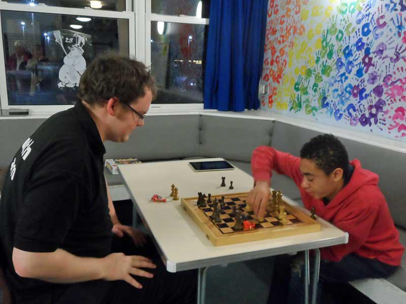 28 February 2014 - Club visits Chiltern Youth Club, part of our investment in the community - Youth Worker Tom Kirker playing chess with Cameron