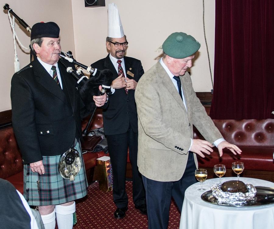 2017 Burns Supper  - Rtn. Barclay Smith and Piper Billy McCreadie  await the invitation from  Arthur Boyle to join in the Toast to the Haggis. 