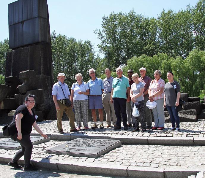 Club Visit to Krakow - Tywyn President Stephanie Purcell lays a candle at the holocaust memorial