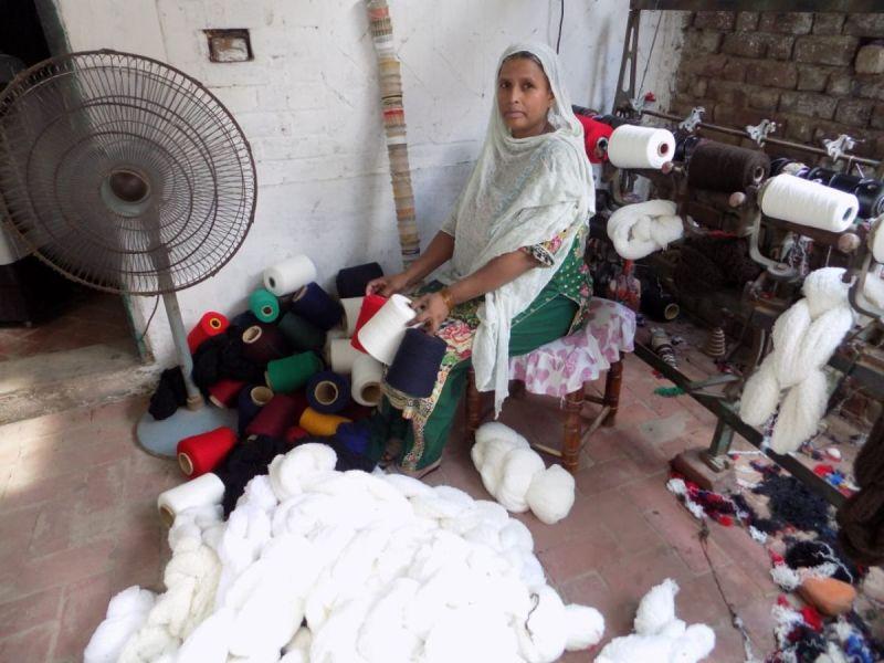 Lendwithcare - Balqees Bibi is paying back her loan on time. She has purchased used and damaged sweaters in bulk which has helped her in selling more yarn. Four women of her locality also work with her. Balqees has purchased a water cooling fan and washing machine. Her 