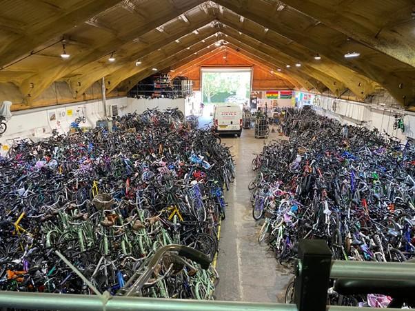 Jackie Wellman recognised in Rotary Magazine for her bike collections - Some of the stock of bikes being prepared for shipment