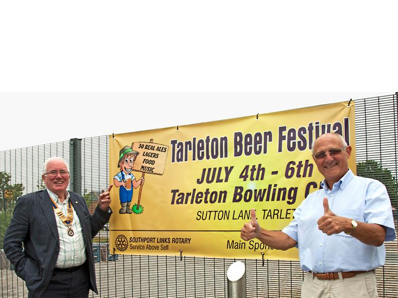 Tarleton Beer Festival 2014 - Bill Thomas and Kevin Allatt show off the Beer Festival Banner in Tarleton