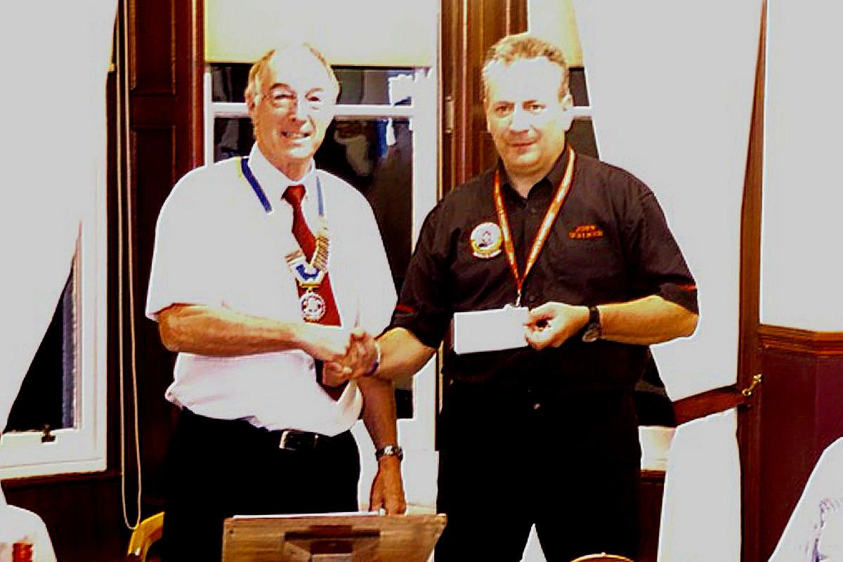 About Us - President David Presents a cheque to the local blood Bikes Group