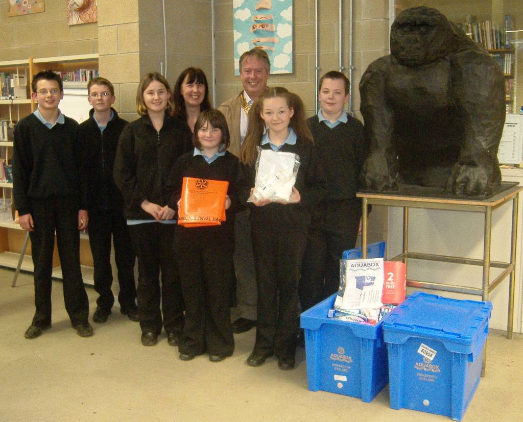 Disaster Aid Effort - Rotary Club of Buxton - After a safe-water talk, students collect by donating at a non-uniform day.