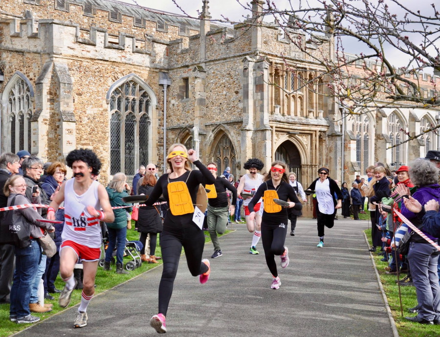 Hitchin Priory Annual Pancake Festival 2017 - Racing through the grounds of St Mary's Church
