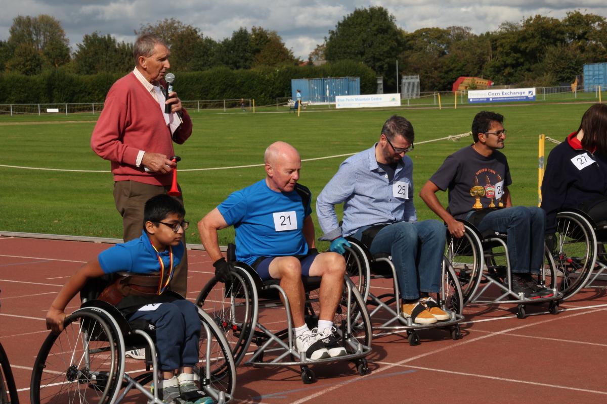 Joint Rotary Clubs Success with “Push4IT” Wheelchair Racing - Master of the Track, Howard Darbon  starts the first 400 meter single lap race - all keen competitors
