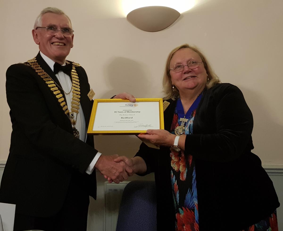 District Governor's Newsletter - September 2018 - RIBI President Debbie Hodge presents Charter Anniversary Certificate to Bedford President John Day