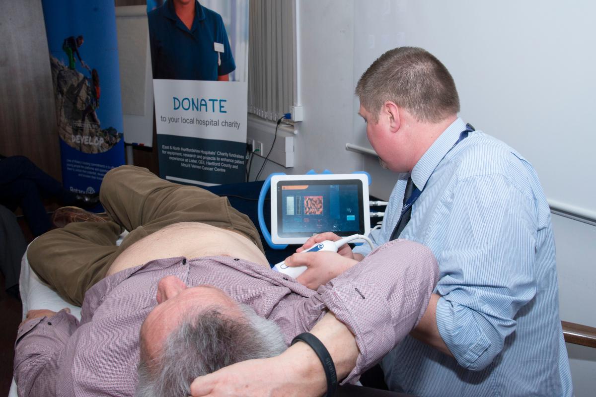 District Governor's Newsletter - April 2019 - a ‘willing’ volunteer at the FibroScanner presentation is relieved to find he has a healthy liver!