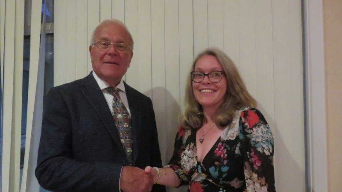 2023 Classic Car Show Donation Presentation - Dave Mile, car show organiser, hands donation to Fransesca Clent of Rye Hospital