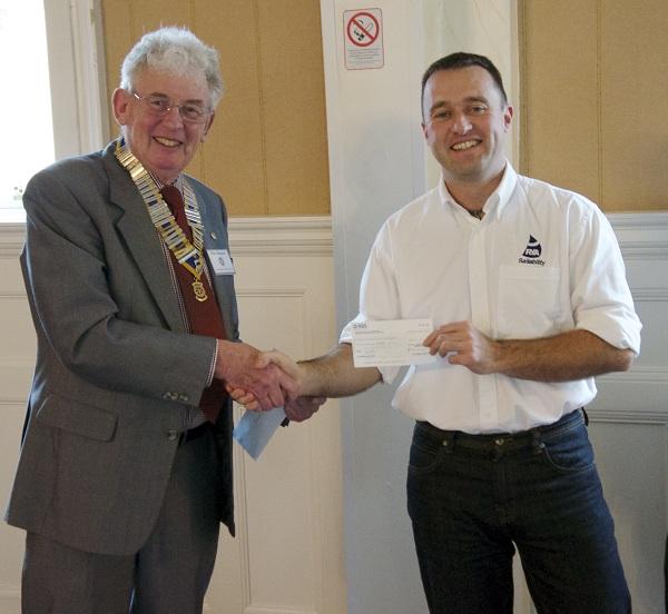 2012 Greenock Rotary Disbursements  - President Mike Kimpton presents a cheque to David Hill, Senior Instructor at Castle Semple Centre, Lochwinnoch.
